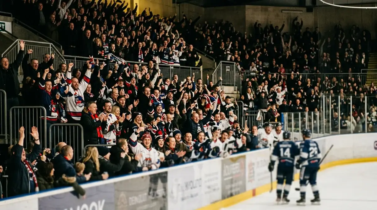 Packed EIHL crowd celebrating a goal during a Saturday-night fixture