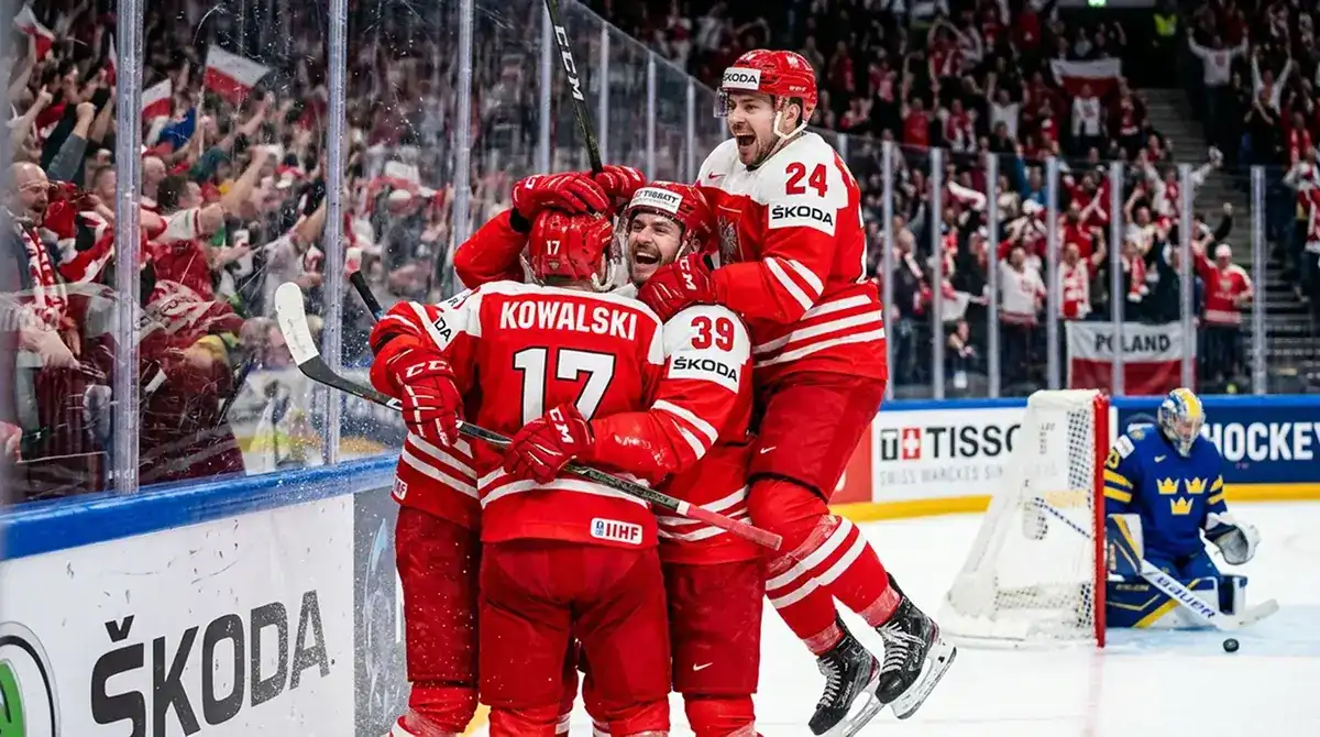 Ice hockey players celebrating goal during IIHF knockout round elimination game
