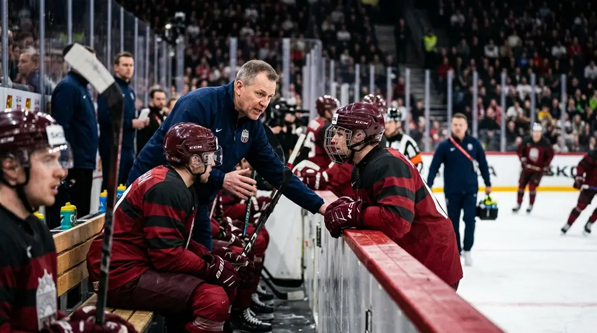 National team head coach speaking with players on bench during 4 Nations round-robin game