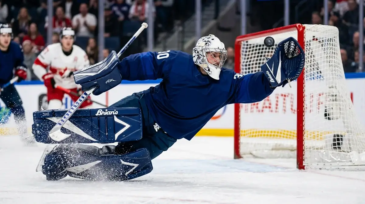 International ice hockey goaltender making glove save during IIHF Worlds game
